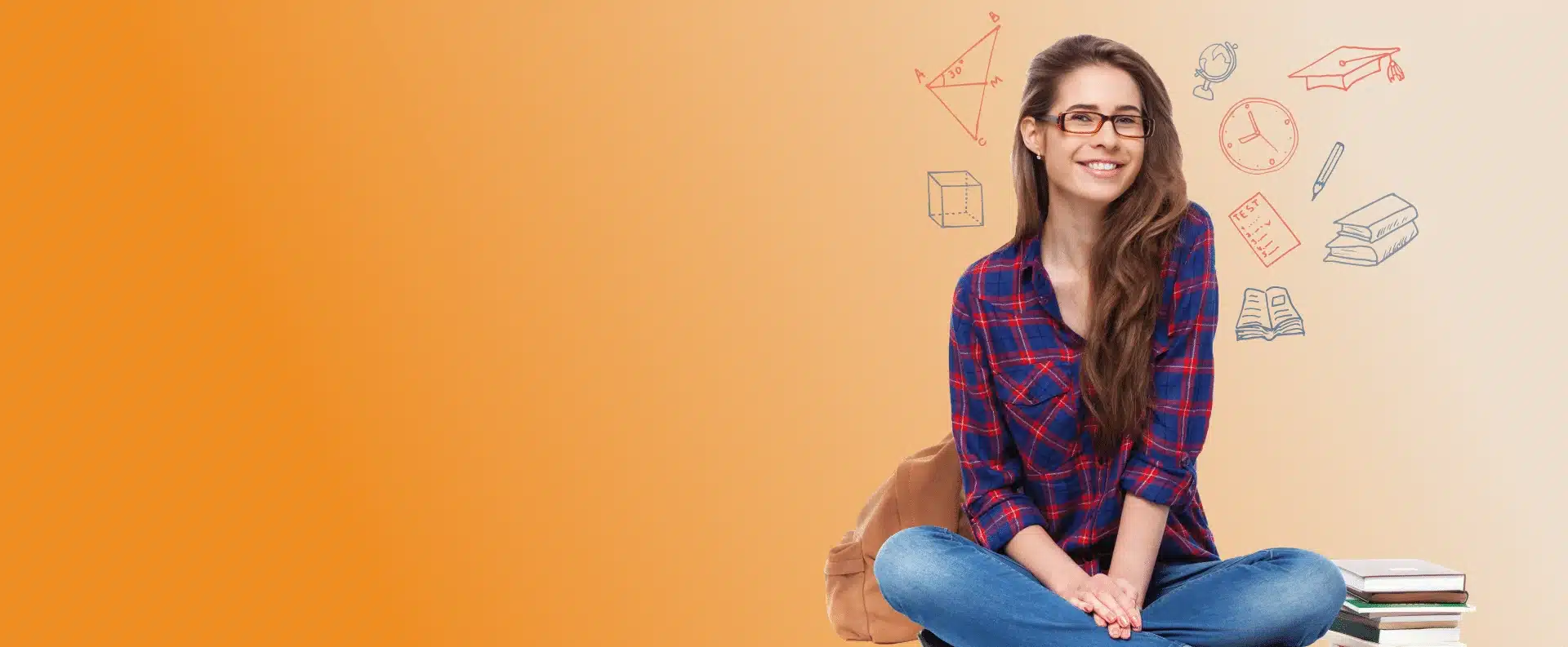 Girl sitting next to books, smiling